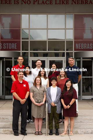 Group portrait of the Academic Navigators outside of the Nebraska Union. First row, l-r: Eric Einspa
