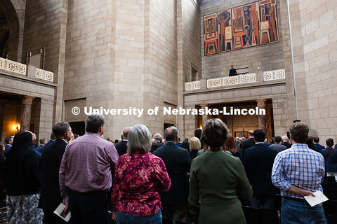 A member of the University of Nebraska-Lincoln choir sings the National Anthem prior to the State of