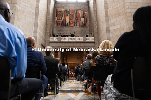 Peter Eklund, Choir Director and Professor of Music, conducts a performance of "One Voice" in the Ro