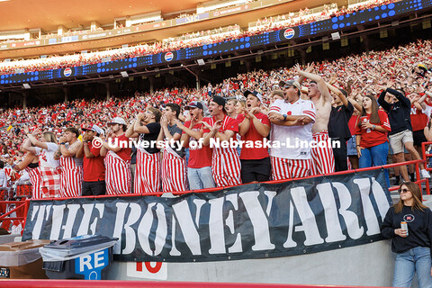 Students “throw the bones” in the boneyard portion of the student section at the Nebraska vs Akr
