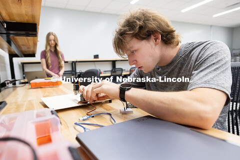 Ian Gouldie, right, and Aleksandra Stansbury, sophomores, robotics engineering majors, connect their