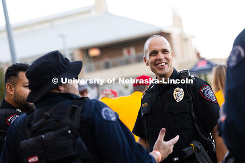University Police Captain John Backer checks in with colleagues from UNLPD and the Lincoln Police De