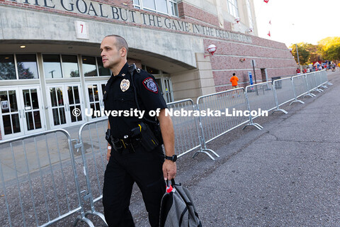 University Police Captain John Backer walks in front of Gate 7 before the NU vs. Houston Christian U