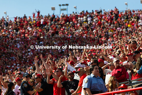 Husker fans cheer after the team completed a Hail Mary with zero seconds remaining before halftime t