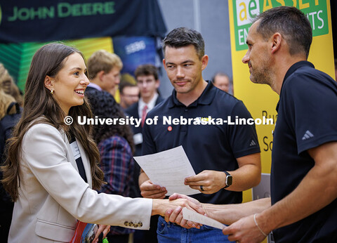 Senior Mechanical Engineering major, Olivia McKeag, shakes hands with a representative from Asset En