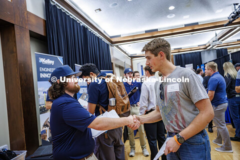 Westley Morrison (right), a mechanical engineering major, shakes hands with a recruiter during the C