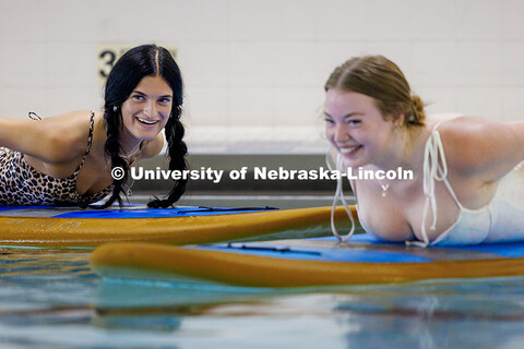 Bella Puetz (left), sophomore Broadcasting and Sports Media and Communication double major, laughs a