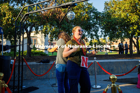 Tianna Boerke (left) and Evelyn Ring dance together at the 360 Touch Photo Booth during the Fiesta o