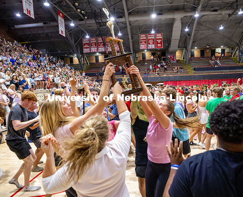 Triad 2: Beta Theta Pi, Delta Gamma and Sigma Alpha holds up the first-place trophy after winning sh