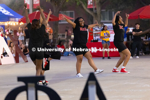 Members of the Delta Sigma Theta sorority chant, sing and dance in front of the Nebraska Union for t