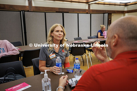 Shelley Zaborowski, the Associate Director of the Alumni Association, rests and eats snacks after do