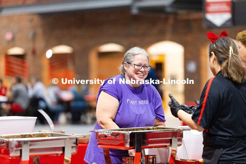 Kandy Hanthorn goes through the buffet line during the Celebration of Service. Hanthorn has been wit