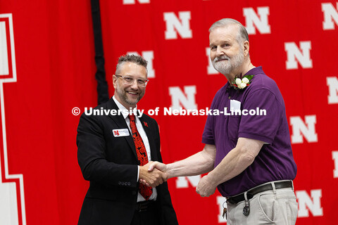 Dave Aiken poses for a portrait with Ben Lennander. Aiken was recognized during the Celebration of S