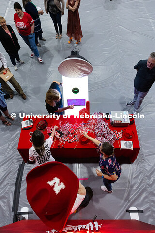 Jennifer Frasier-Davison (left) and Brandi Sigmon (right) pick out props at the photo booth for a pi