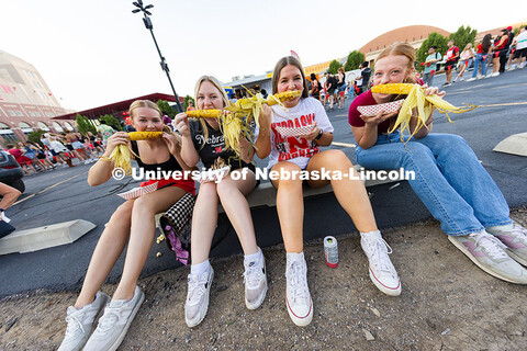 Bryn Lambe (from left to right), Alexis Warner, Addison Warner and Audrey Wilson munch on ears of co