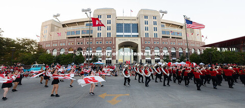 The UNL Marching Band performs in front of Memorial Stadium as part of the Homecoming parade. Homeco