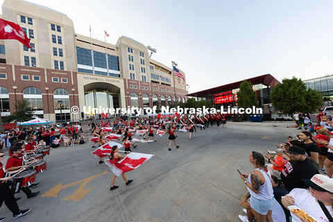 Fans line East Stadium Drive to cheer on the marching band during the Homecoming parade. Homecoming 