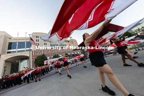 The UNL Marching Band performs in front of Memorial Stadium as part of the Homecoming parade. Homeco