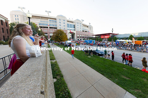 Emma Furlong watches the Homecoming parade from a perch in front of Bessey Hall. The sophomore came 