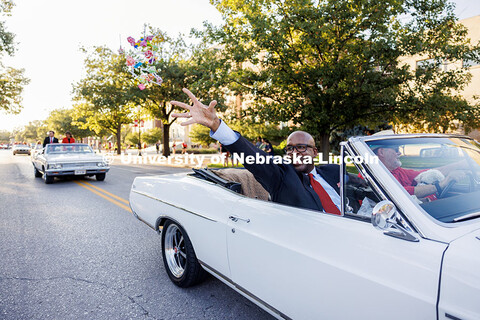 Chancellor Rodney Bennett tosses out candy from a vintage car during the homecoming parade. 2025 Hom