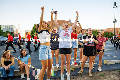 Spectators cheer on the Homecoming 2025 parade in front of Memorial Stadium. Homecoming parade and C