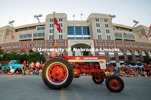 A member of the Tractor Restoration Club passes by in the Homecoming 2025 parade in front of Memoria