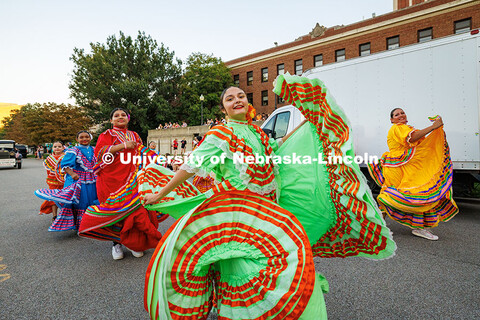 A member of the Sangre Azteca Dance Group passes by in the Homecoming 2025 parade. Homecoming parade