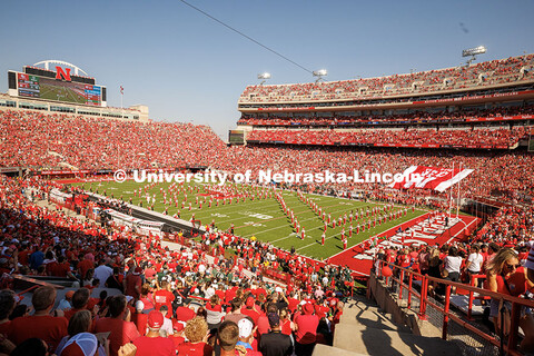 A wide shot of the Cornhusker Marching Band performing their pregame performance. Nebraska vs Michig