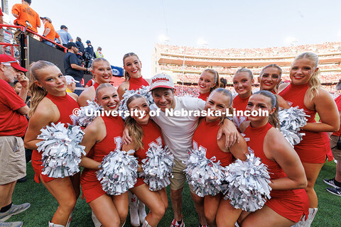 The Husker Scarlets pose with Adam Devine during the Huskers vs. Michigan State football game. Nebra