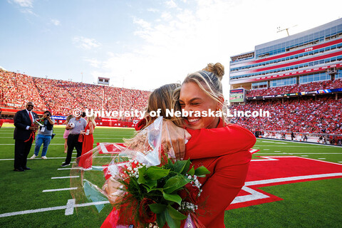 Claire Kelly (left) and Ava Hollingsworth, the two 2025 Homecoming Queens, hug after being crowned. 