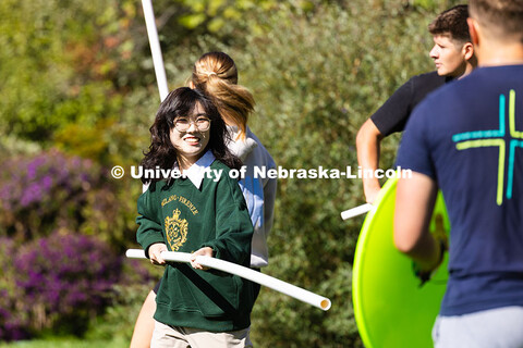 Sunhee Park, a senior majoring in classics and religious studies, uses a PVC pipe polearm in a mock 
