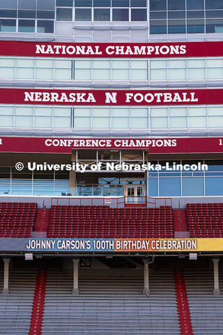 Graphics commemorate Johnny Carson's 100th birthday on the screens in Memorial Stadium. October 16, 