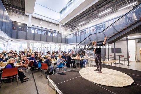 Michael Pritza, a graduate student in Emerging Media Arts, presents his work to the audience. Johnny
