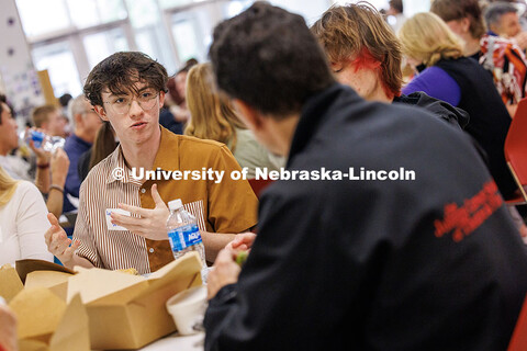 Luka Benjamin (left), senior Acting major, speaks with Larry Witzer, Johnny Carson Foundation member
