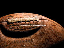 Football autographed by a team from the 1940s resides in a trophy case in Memorial Stadium. Memorabi