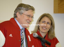 Jeffrey S. Raikes and his wife, Tricia, speak at a noon luncheon honoring them. They were given the 