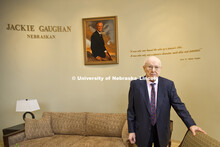 Dedication ceremony for the Jackie Gaughan Multicultural Center. Jackie Gaughan poses by his picture