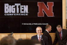 UNL Chancellor Harvey Perlman is all smiles as he discusses the Husker's new conference.  In the bac