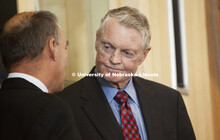UNL Athletic Director Tom Osborne talks with Big Ten Commissioner James Delaney during the press con