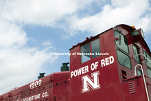 The power of red and the Nebraska logo adorns a red EMD locomotive in Holdrege, NE. 