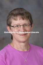 Studio portrait of Andrea Dinkelman, Science Librarian, University Libraries. August 20, 2014. 