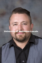 Studio portrait of JD Madsen, Assistant Professor, Johnny Carson School of Theatre and Film, FPA. Au