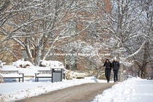 Students crossing campus to get to class. Michaela Dreeszen and Danielle Williams talk on the way to