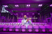 Harkamal Walia checks the progress of a rice plant growing in the Lemna Tech High Throughput Phenoty