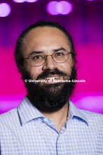 Harkamal Walia checks the progress of a rice plant growing in the Lemna Tech High Throughput Phenoty