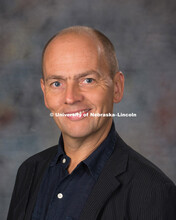 Studio portrait of Jason Griffiths, New Faculty Photo Shoot, August 19, 2015. 