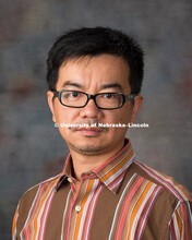 Studio portrait of Jiong Hu, New Faculty Photo Shoot, August 19, 2015. 