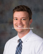 Studio portrait of Elliot Tebbe, New Faculty Photo Shoot, August 19, 2015. 