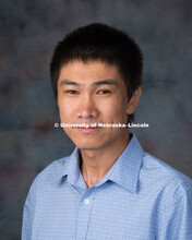 Studio portrait of Sheng Wei, New Faculty Photo Shoot, August 19, 2015. 