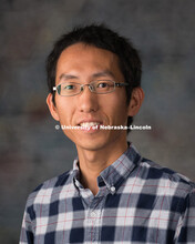 Studio portrait of Yuzhen Zhou, New Faculty Photo Shoot, August 19, 2015. 